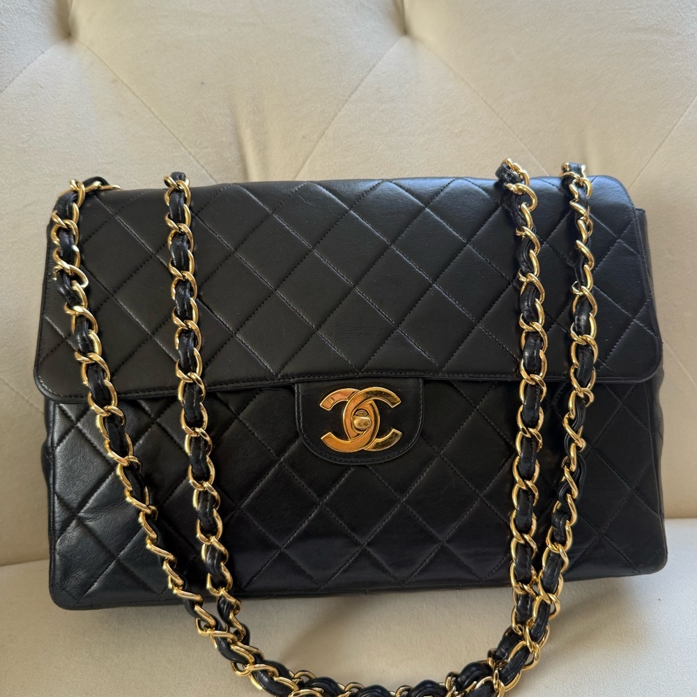 Vinatge Chanel Black Quilted Leather 24k gold plated hardware